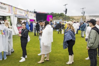 Festival visitors in front of a food stand at the Lollapalooza Festival in the Olympic Stadium and