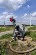 Mobile pump for artificial irrigation with a sprinkler system in a field where sugar beet is grown,