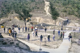 Sunday fun people playing ball game at the Peak, Hong Kong, Asia, 1964