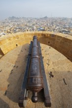 Cannon in the fortress of Jaisalmer, back view of the city, Rajasthan, India