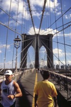 Jogger on the Brooklyn Bridge, New York City, USA