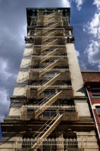 Residential tower with fire escape Downtown, New York City, USA