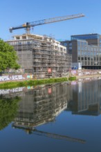 Construction site on the Weser, new building, construction crane, scaffolding, architecture, modern