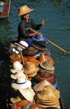 Hat seller in her boat at Damnoen Saduak Floating Market, Thailand, December 2002, vintage, retro,