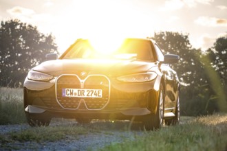 BMW photographed on a natural path in sunlight, BMW i7 electric car, Deer e-Carsharing, Calw,
