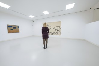 Woman looking at a work of art in a bright, minimalistic gallery space, Schauwerk, Sindelfingen,
