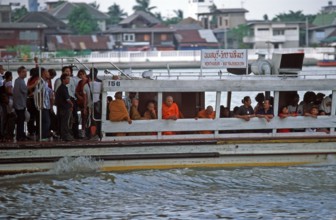Liner on the Mae Nam Chao Phraya River, people, monks, children, Bangkok, Thailand, December 2002,