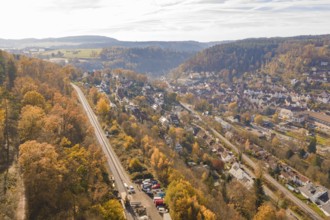 Autumn village surrounded by hills and forests with a clear view from above, Calw, Black Forest,
