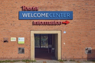 Welcome Center, tourist information, façade, brick, passage arch, sunny, Kiel, state capital,