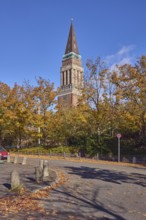Town Hall Tower, sidewalk, barrier bollard, road, curve, traffic sign absolute stopping, trees,