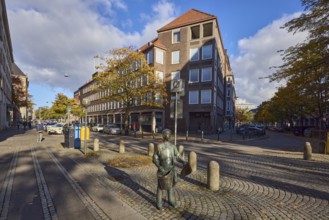 Bronze sculpture newspaper boy, sculptor Frauke Wehberg, street made of paving stones, general