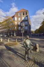 Bronze sculpture newspaper boy, sculptor Frauke Wehberg, street made of paving stones, general