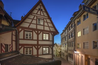 Historic half-timbered houses with a view of the Christmassy decorated Tiergärtnertorplatz in the