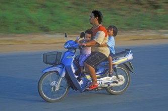 Father with his two children on a moped, Krabi, Thailand, December 2002, vintage, retro, old,