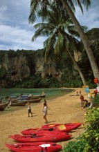 Palm trees, longtail boats, kayaks, people, Ton Sai beach, two years in front of the tsunami,