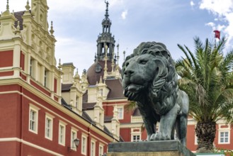 Lion in front of Muskau Castle in the UNESCO World Heritage Site Muskauer Park or Park Muzakowski