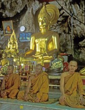Buddha statue, monks praying, Wat Tam Sua monastery near Krabi, Thailand, December 2002, vintage,