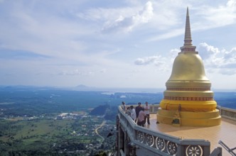 View, people, chedi in the monastery of Wat Tam Sua, which is partly on the top of a mountain,