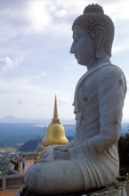 Buddha statue and chedi in Wat Tam Sua monastery, which is partly on the top of a mountain, Krabi,