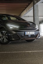 A modern car in a parking garage with dim lighting, Cupra electric car, e-car sharing, Calw,