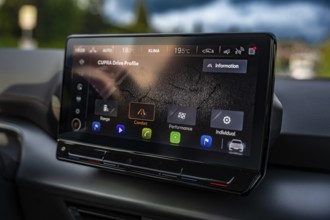 Modern infotainment display in a Cupra vehicle with various driving profiles and navigation