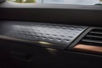 Close-up of a modern, structured dashboard in a vehicle with elegant design elements, Cupra