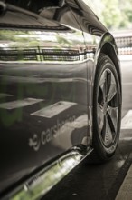 Close-up of a car with reflections and distinctive details, Cupra electric car, e-car sharing,