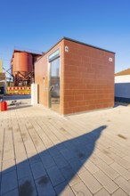 Small, modern brick building with clear skies, Weil der Stadt railway station, Germany