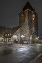 Medieval debt tower in evening lighting, built around 1323, front island of Schütt, Nuremberg,