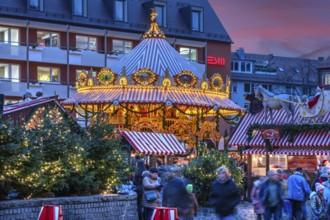 Nostalgic children's carousel at the children's Christmas market in the evening, Hans Sachs Platz,