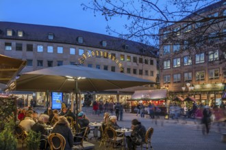 Busy alleyway café in the evening during Advent in Spitalgasse, Nuremberg, Middle Franconia,
