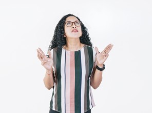 Young woman screaming with her hands in the air. Frustrated girl screaming with hands in the air