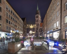 Evening Königstraße with subway entrance and St. Lorenz church in Advent lighting, Nuremberg,