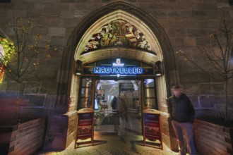 Historic entrance portal to the former Mauthalle, with imperial eagle and city coat of arms, built