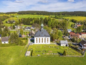 Aerial view, drone photo: Schwarzbach church and cemetery, forest and blooming meadows in the back,