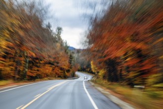 Car, rain-wet road, curvy country road, autumn leaves, Indian summer, smudge effect, blur,