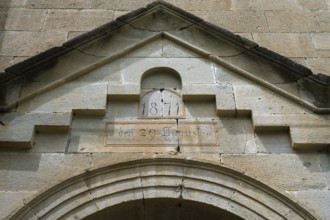 Historic stone structure with inscription and pediment from 1871, German Evangelical Lutheran