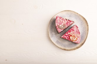 Chocolate cake on white wooden background, top view, flat lay, copy space