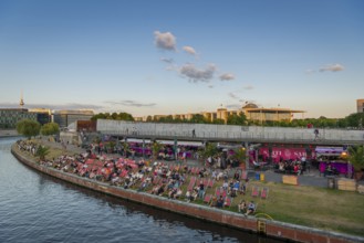 Summer evening at a beach bar in the government district on the Spree, Berlin