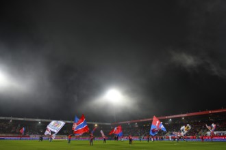 Floodlight show, totals, flag wavers, flags, choreography in front of the start of the game, fog,