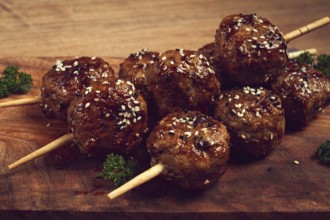 Tsukune, Japanese meatballs, minced chicken, fried on a skewer, with yakitori sauce, homemade, no
