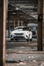 Front view of a car in an industrial, abandoned environment, Deer E-Car Sharing, Motorworld