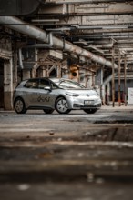 A vehicle is parked in an old factory with an industrial, raw character, Deer E-Car Sharing,