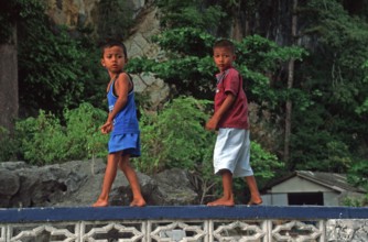 Little boys, children in the stilt village of Ko Pannyi in Phangnga Bay near Ko Phuket, two years