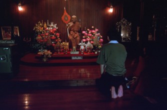 Wax monk at Wat Chalong monastery, believers praying, Ko Phuket, Thailand, December 2002, vintage,