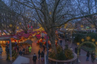 Christmas market on Holstenplatz in Kiel, city center, trees, shops, pedestrian zone, early