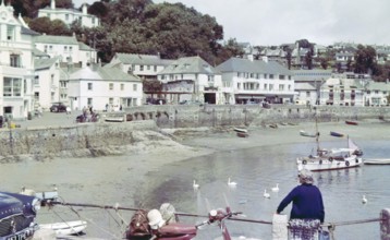 Historic waterfront buildings around the harbour at St Mawes, Cornwall, England, UK c 1960