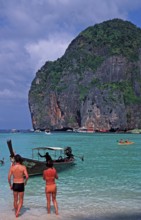 People, longtail boat on Maya Bay beach, known from the movie The Beach, one year in front of the