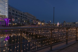 Christmas decoration in Kiel at the boat harbor, festive lighting, glow of lights, evening,