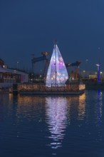 Christmas decoration in Kiel at the boat harbor, festive lighting, glow of lights, evening,